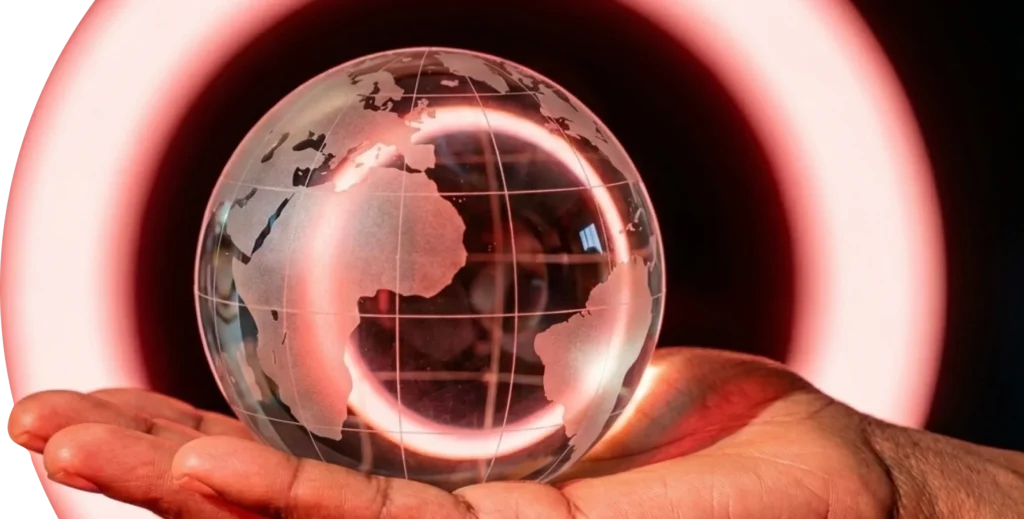 A symbolic image representing global connectivity and pan-African technology innovation, showing a glass globe held in a palm.